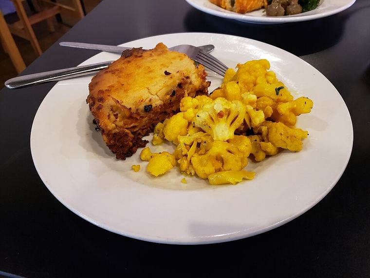 A cut lasagna showing separate noodle layers.