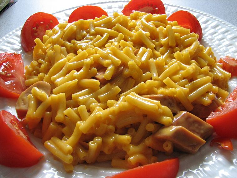 A box of macaroni and cheese with a processed cheese sauce.